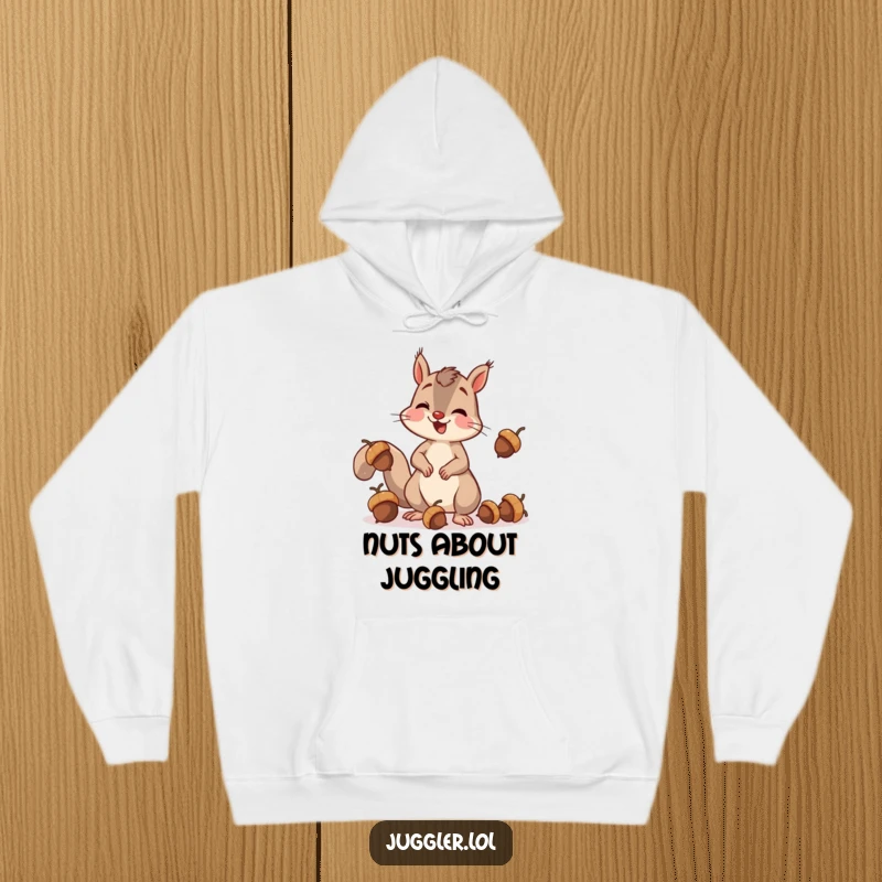 Funny squirrel hoodie showing a cheerful squirrel in the act of juggling acorns, accidentally dropping one with surprise, great for warmth and laughs.